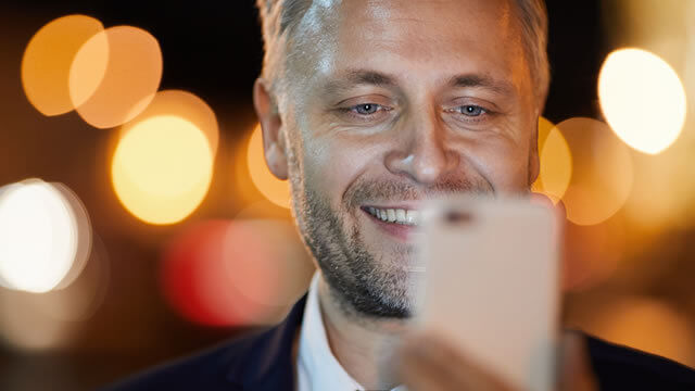 Man watching video on phone for better customer experience