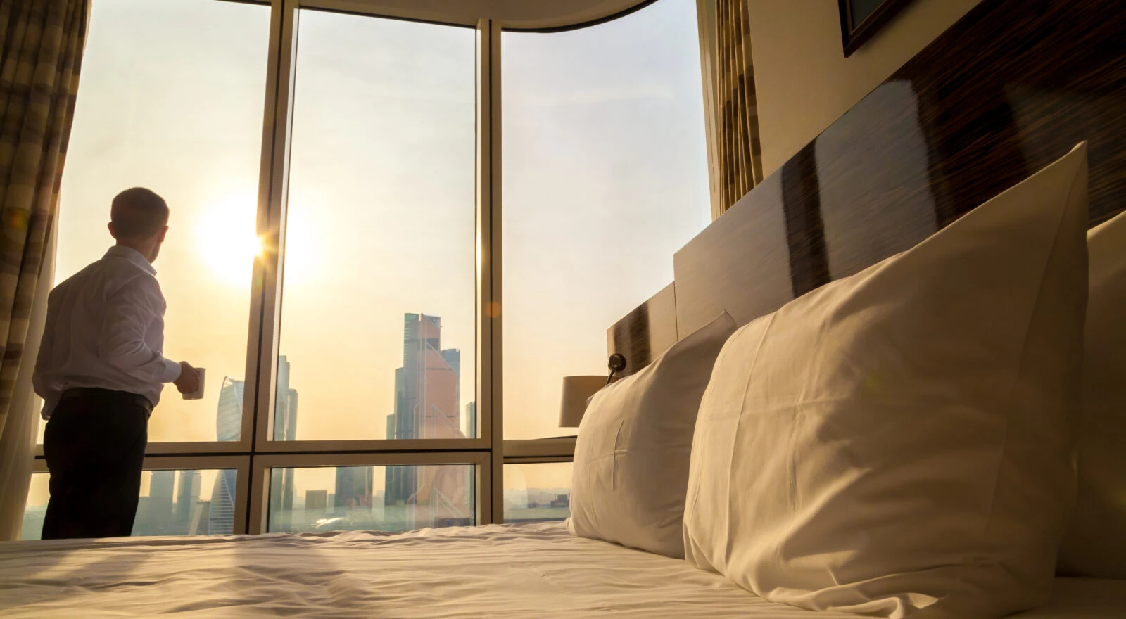 Man looking out of the window envisioning the future of travel