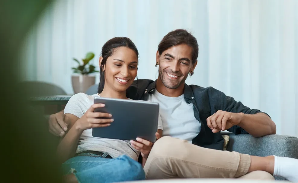 Two people watching video marketing example on tablet