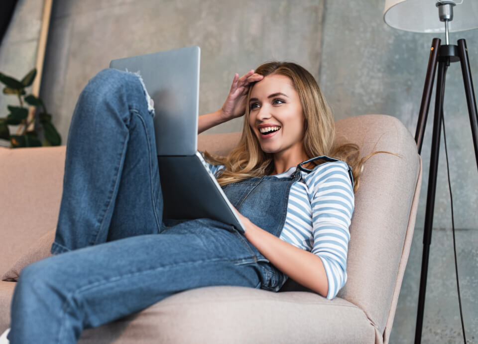 Woman with a laptop sitting in the chair